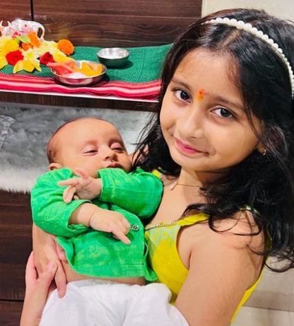 Myra Vaikul with little brother photo